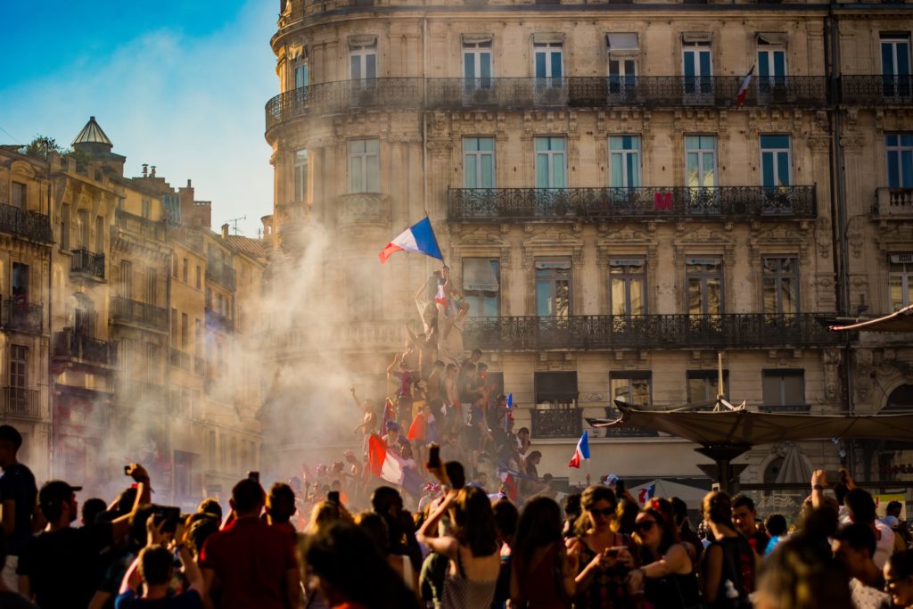 crowd-in-Paris-celebrating-with-French-Flag